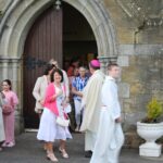 Parishioners leaving the church after the ceremony